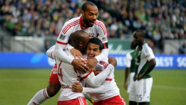 Teammates Tim Cahill and Thierry Henry celebrate a goal for New York Red Bulls.