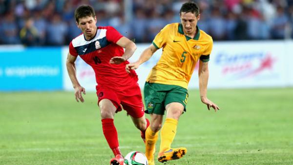 Mark Milligan in action against Kyrgyzstan.