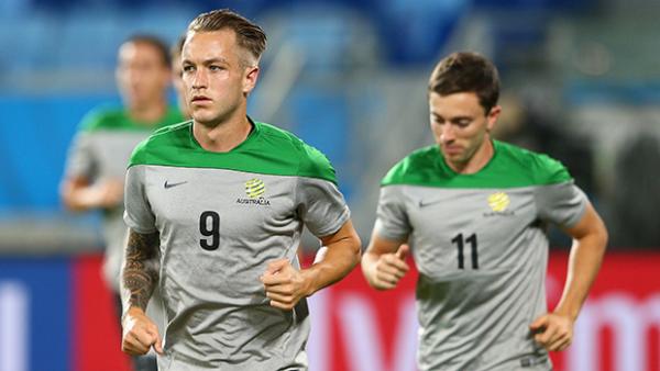 Socceroos striker Adam Taggart is desperate to make it onto the field in Brazil.