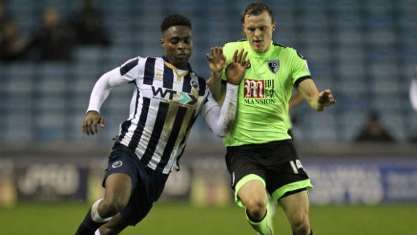 Defender Brad Smith challenges Millwall's Fred Onyedinma for the ball in the third round of the FA Cup.