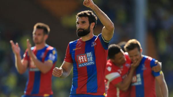 Mile Jedinak celebrates after Crystal Palace's opening day win.