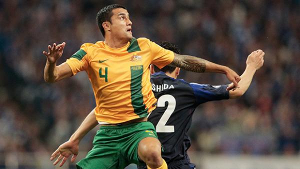 Tim Cahill flies high against Japan in a Socceroos World Cup qualifier.