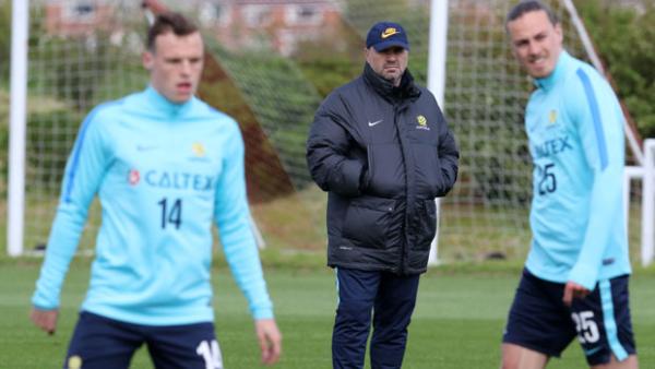 Ange Postecoglou runs his eyes over the Socceroos during training in Sunderland.