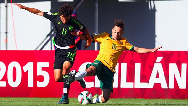 Jonathan Vakirtzis makes a lunging tackle to stop a Mexican attack.