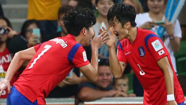 Son Heung Min of Korea Republic celebrates with teammate Kim Jin Su.