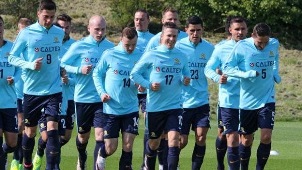 Socceroos players are put through their paces in England.