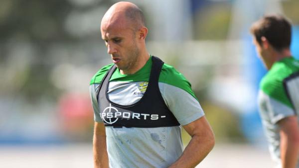Mark Bresciano is put through his paces during a Socceroos training session.