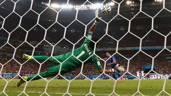 Costa Rican goalkeeper Keylor Navas saves a crucial penalty from Theofanis Gekas of Greece.