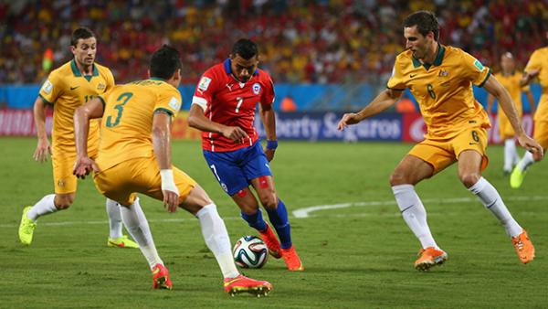 Alexis Sanchez in action against the Caltex Socceroos at the 2014 FIFA World Cup in Brazil.