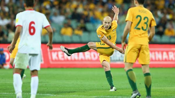 Aaron Mooy fires a shot on goal during Australia's 7-0 win over Tajikistan.