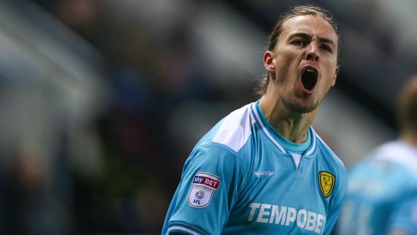 Jackson Irvine's Burton Albion have been drawn to play Manchester United in the next round of England's Carabao Cup (League Cup).