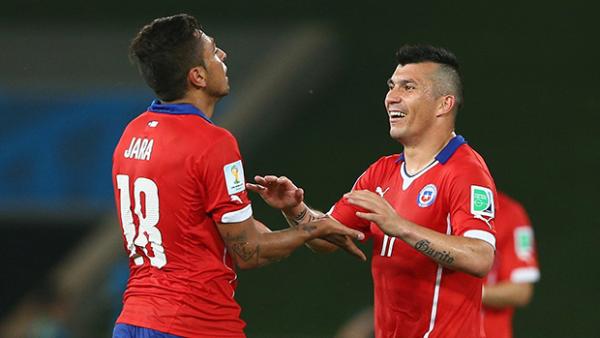 Chile's Gonzalo Jara and Gary Medel celebrate after defeating the Socceroos.