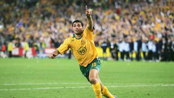 John Aloisi about to run off to celebrate after stroking home the penalty that sent the Caltex Socceroos to the 2006 FIFA World Cup.