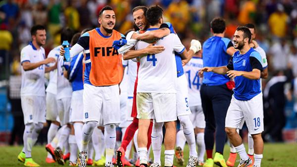 Greece celebrate after their 2-1 victory over Ivory Coast.