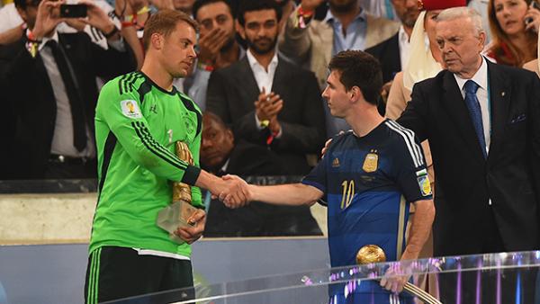 Golden Glove recipient Manuel Neuer shakes hands with Golden Ball winner Lionel Messi.