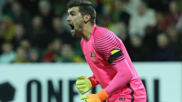 Goalkeeper Mat Ryan yells instructions while between the posts for the Caltex Socceroos.