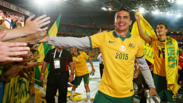 Tim Cahill celebrates the Socceroos' win in the Asian Cup final with fans.