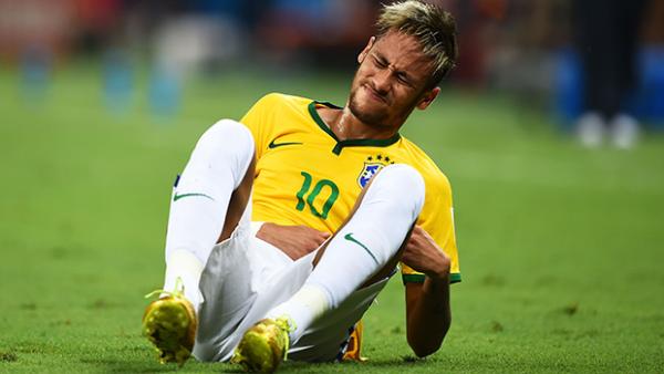 Neymar stays down after being felled against Colombia.