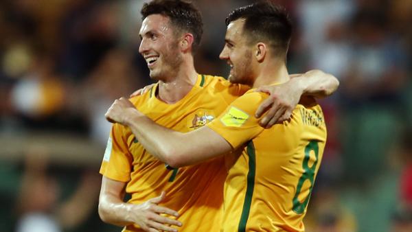Apostolos Giannou celebrates a goal with teammate Bailey Wright.