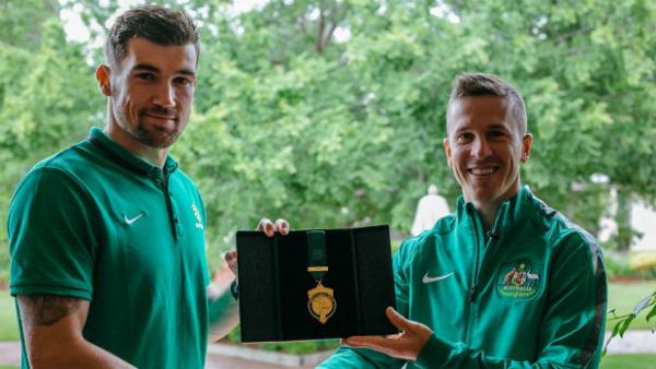 PFA President Matt McKay presents Socceroo goalkeeper Mat Ryan with his 2015 medals.