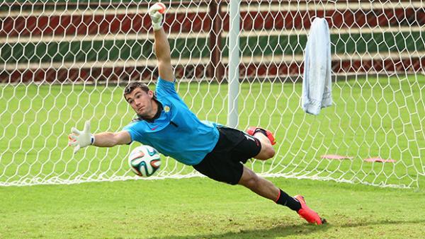 Socceroo Mat Ryan makes a save during training at the World Cup.