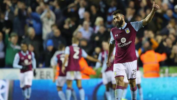 Mile Jedinak acknowledges Aston Villa supporters.