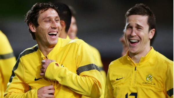 Socceroos Mark Milligan and Matt McKay sharing a laugh on the training ground.