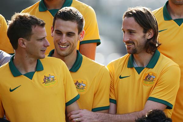 Josh Kennedy bonds with teammates during the Socceroos official team photograph session.