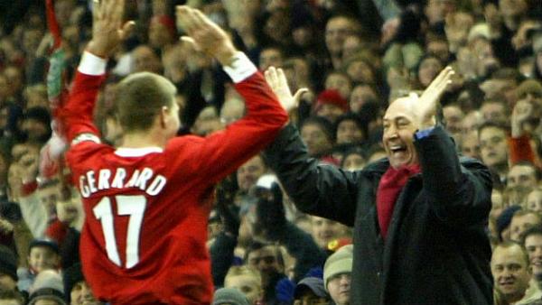 Former Liverpool captain Steven Gerrard and manager Gerard Houllier celebrate at Anfield.