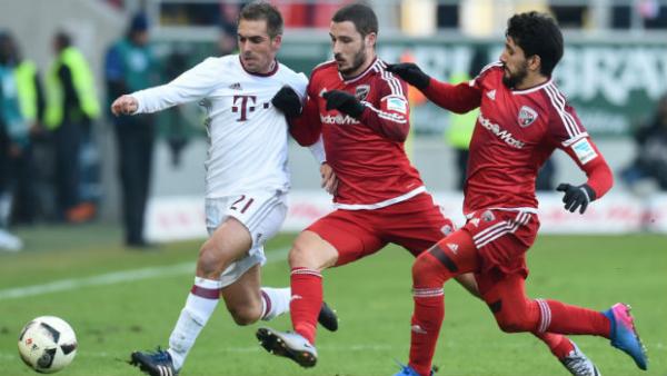Mathew Leckie tackles Bayern Munich's Philipp Lahm in their Bundesliga clash.