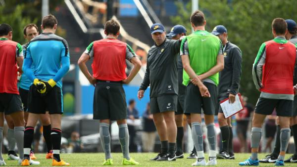 Socceroos boss Ange Postecoglou addresses his players during a training session in Melbourne.