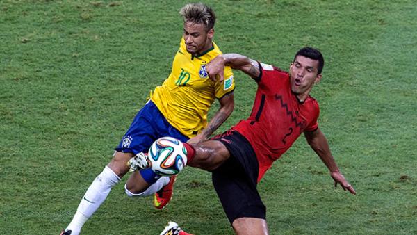 Brazil's Neymar gets in a tangle with Mexico's Francisco Javier Rodriguez during their goalless draw.