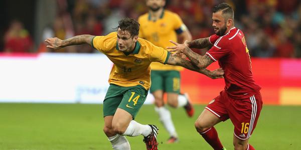 Chris Herd fends off the attention of Belgium's Steven Defour.