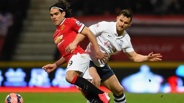 Manchester United superstar Falcao is challenged by Aussie defender Bailey Wright.
