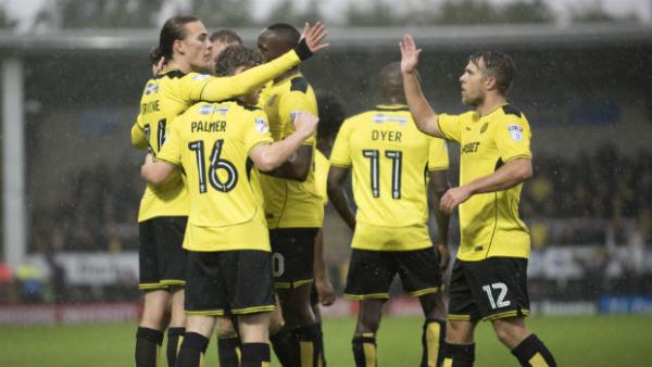 Jackson Irvine celebrates scoring a goal with his Burton Albion teammates in this season's English Championship.